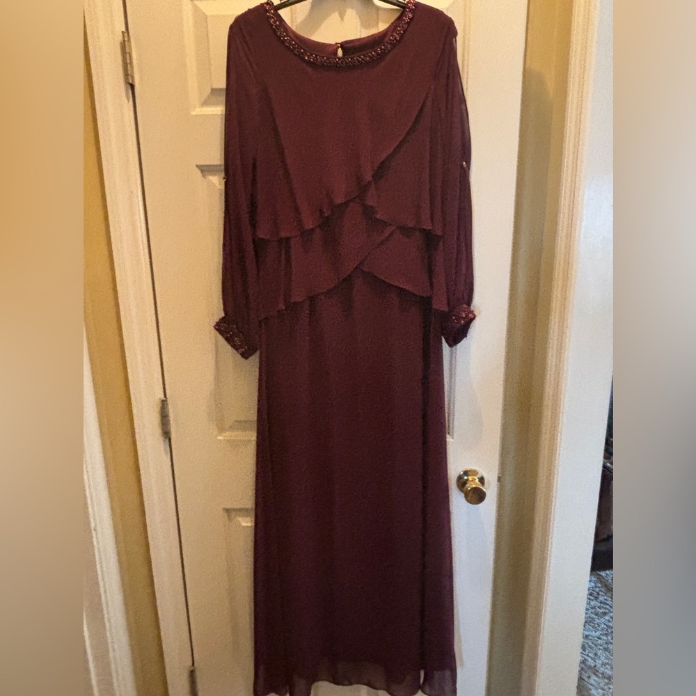 Burgundy full length elegant dress w/elegant beading on neckline and wrist cuff.